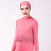 Woman in pink shirt with matching pink HAWA headwrap.